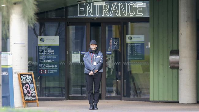 A security guard outside the safe injecting room at North Richmond community centre. Picture: Wayne Taylor