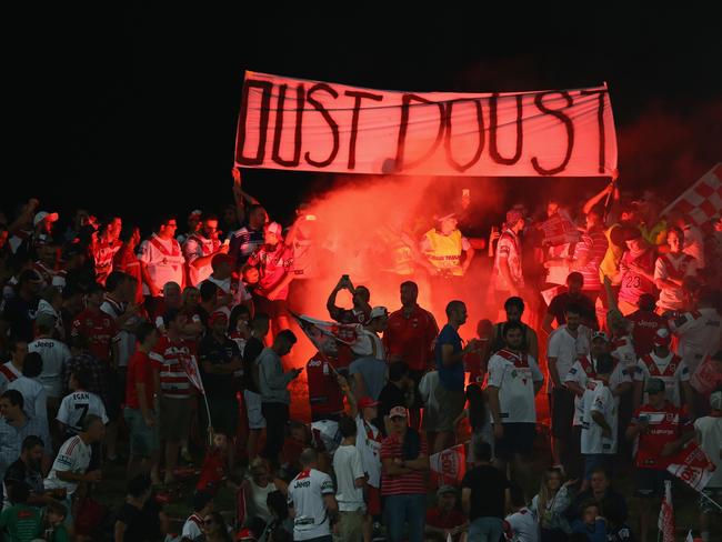 Dragons supporters hold up a banner reading “Oust Doust” at Kogarah Oval.