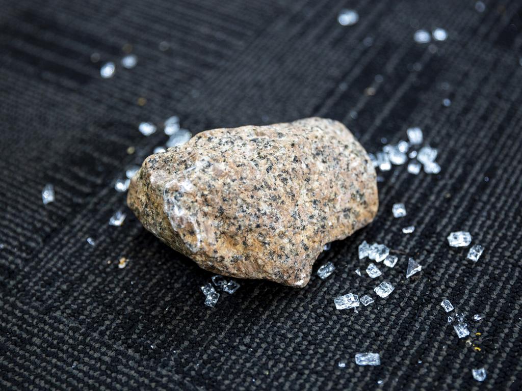 A granite rock was left among the glass of Creative Jewellers, The Harvest Press and Warehouse 73 Emporium. Picture: Floss Adams.