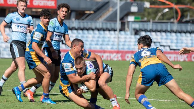 Cronulla’s Chevy Stewart gets locked in an Eels tackle. Picture: Monique Harmer