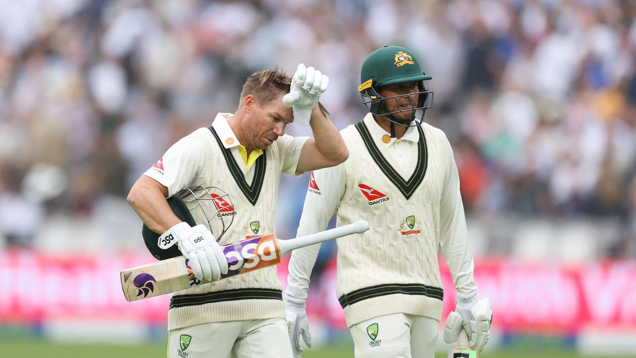 David Warner and Usman Khawaja walk off during the brief rain break. Picture: Getty