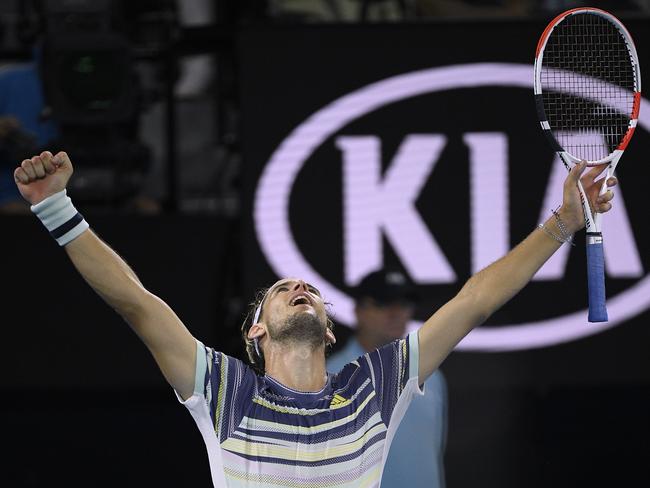 Austria's Dominic Thiem celebrates after defeating Spain's Rafael Nadal in their quarterfinal match at the Australian Open tennis championship in Melbourne, Australia, Wednesday, Jan. 29, 2020. (AP Photo/Andy Brownbill)