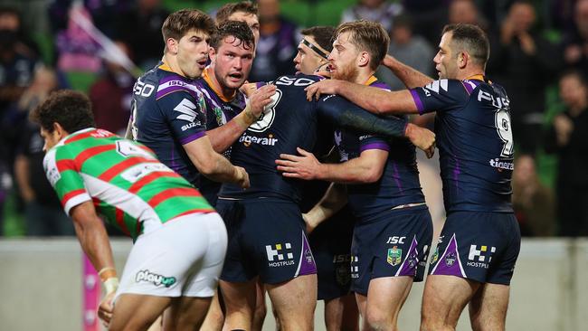 Dane Gagai looks on as Cheyse Blair celebrates a try with Storm teammates. Picture: Getty Images