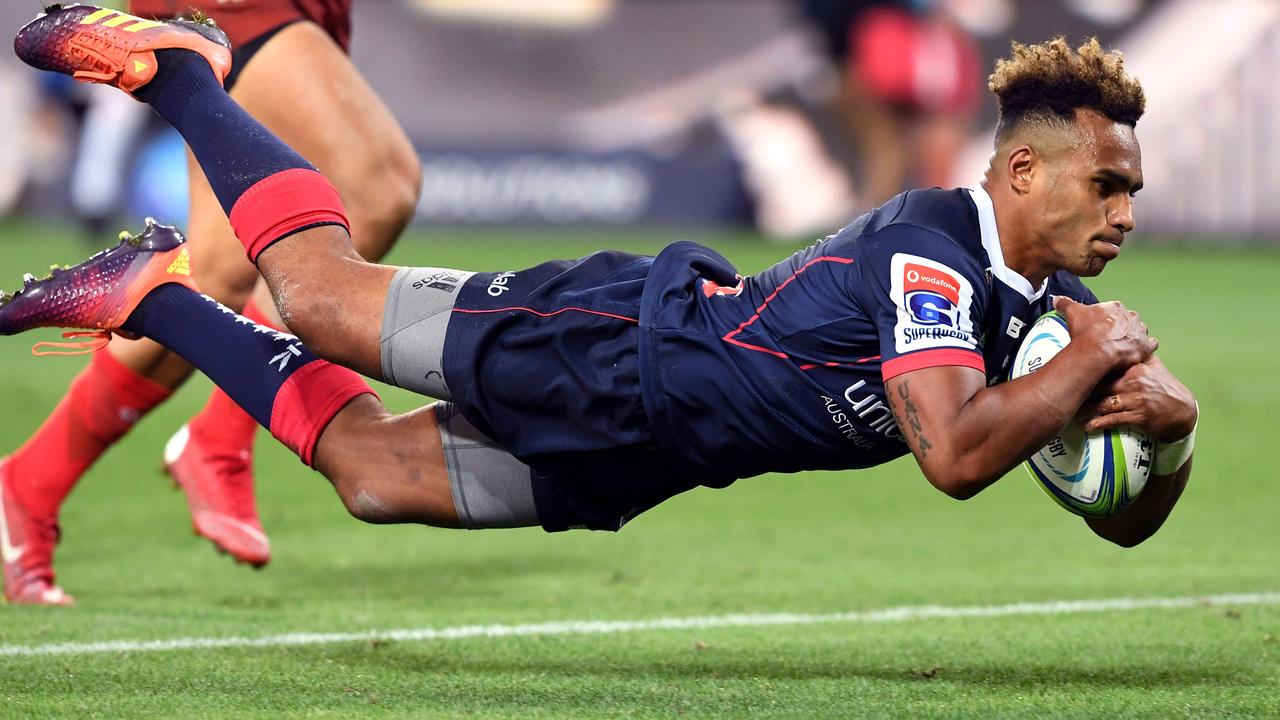 Rebels star Will Genia dives over the tryline to score against the Sunwolves.