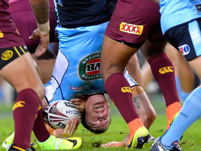 BRISBANE, AUSTRALIA - JUNE 22: Paul Gallen of the Blues is upended in the tackle Sam Thaiday of the Maroons during game two of the State Of Origin series between the Queensland Maroons and the New South Wales Blues at Suncorp Stadium on June 22, 2016 in Brisbane, Australia. (Photo by Bradley Kanaris/Getty Images)