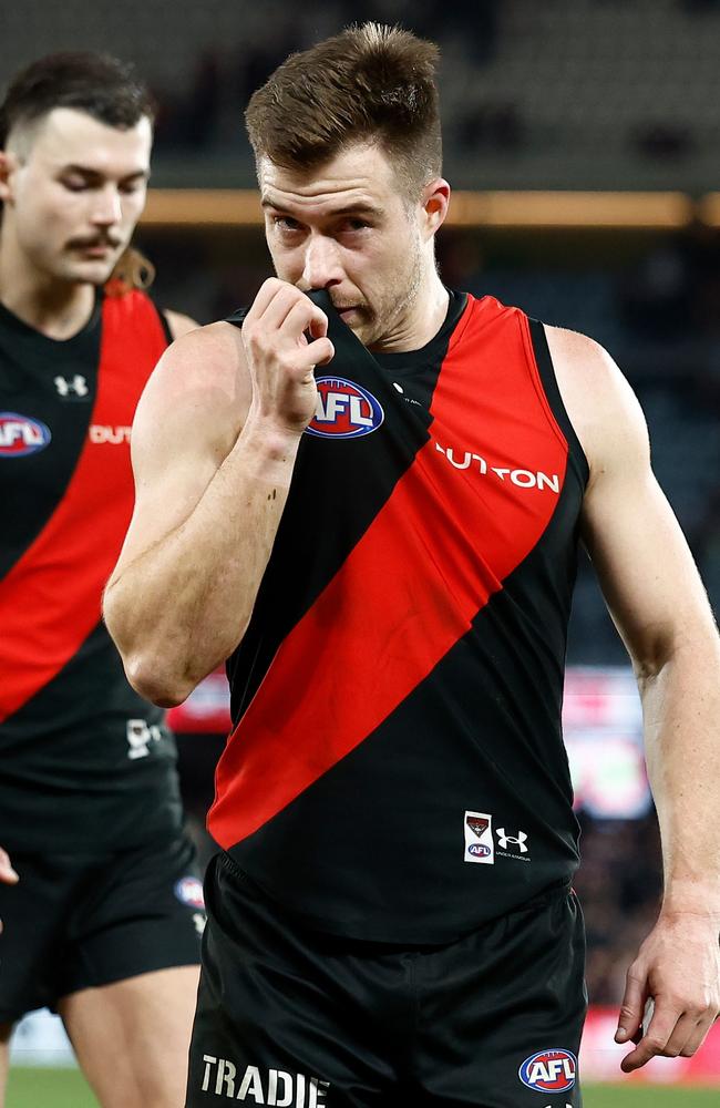 Skipper Zach Merrett leads the Bombers off Marvel Stadium. Picture: Michael Willson/AFL Photos