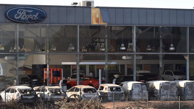 A picture taken in Vitrolles, north of Marseilles on August 11, 2016 shows burnt cars in front of a Ford factory following a fire which has devastated some 3300 hectares. Picture: AFP