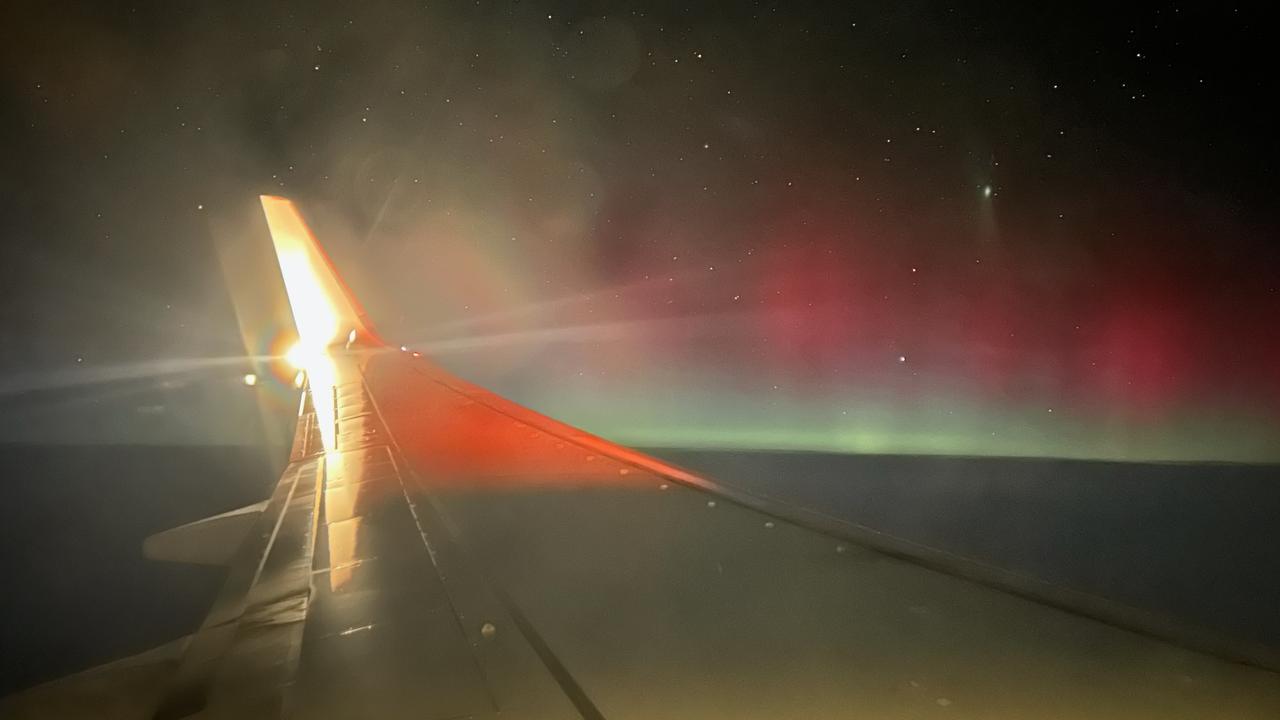 Aurora Australis lights up the South Australian sky on Sunday, viewed from 10,000m at the top of this plane’s descent into Adelaide. Picture: Gemma Jones