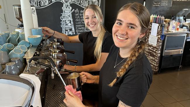 Baristas Zoey Wooster, front, and Maddie Best, back, on the $25,000 Slayer coffee machine, which is made in Seattle and designed by Australian baristas.