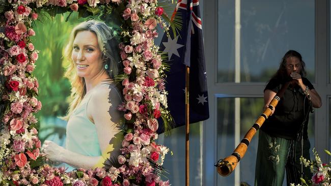 Johanna Morrow plays the didgeridoo during a memorial service for Justine Ruszczyk Damond at Lake Harriet in Minneapolis. Picture: AP