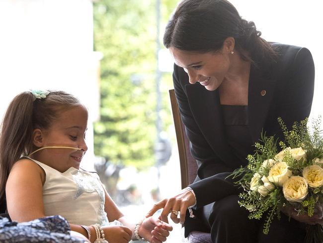 Spina bifida patient Matilda Booth gave the Duchess a post of flowers. Picture: MEGA