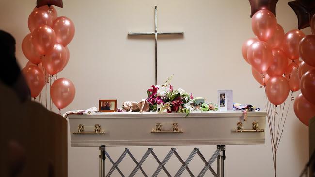 Shelbi’s coffin adorned with flowers and photographs. Picture: NIKKI DAVIS-JONES