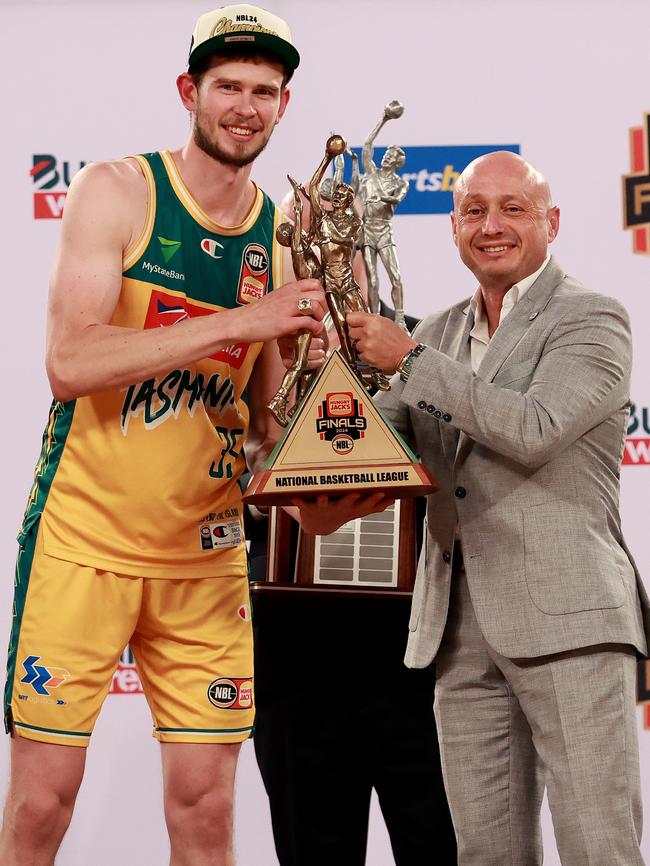 Jackjumpers captain Clint Steindl with Larry Kestelman after the Tasmanian team won the grand final series in March. Picture: Getty Images