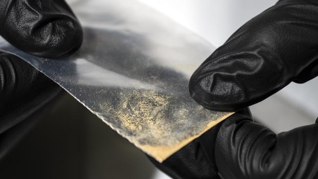 Alex Krotulski, 32, associate director and forensic toxicologist, holds a nitazene powder sample at the Center for Forensic Science Research and Education on Friday, Oct. 20, 2023, in Willow Grove, Pa. Nitazenes are a class of synthetic opioids typically sold as heroin and are estimated to be several times more potent than fentanyl.(Photo by Joe Lamberti for The Washington Post via Getty Images)