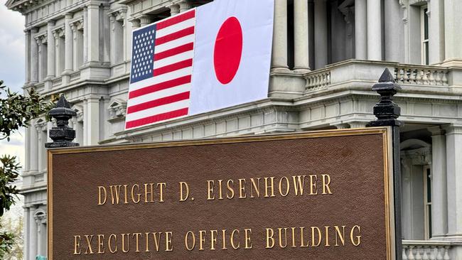 US and Japanese flags are seen posted on the Eisenhower Executive Office Building next to the White House in Washington. Picture: AFP.