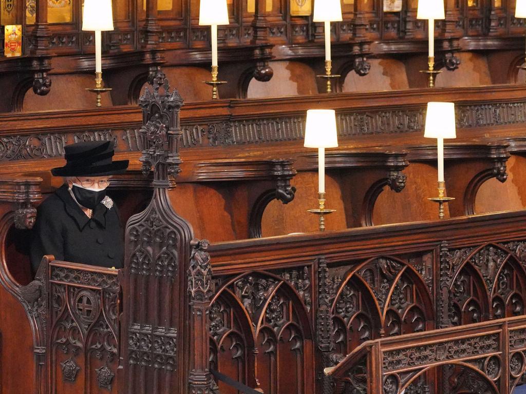 The Queen sits alone, separated from her family for the funeral of her beloved husband.