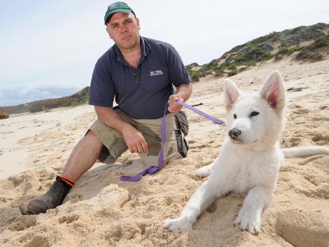 Dog lover Danny Twil, with dog Chandra, says a Mornington Peninsula Shire Council crackdown on unruly dogs at beaches has left owners fuming. 