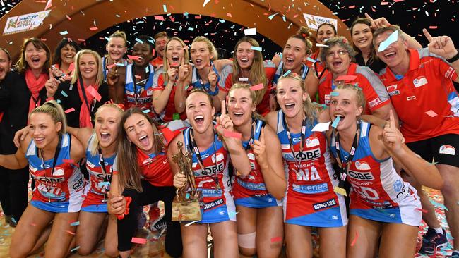 Swifts players celebrate winning the Super Netball season decider last year.