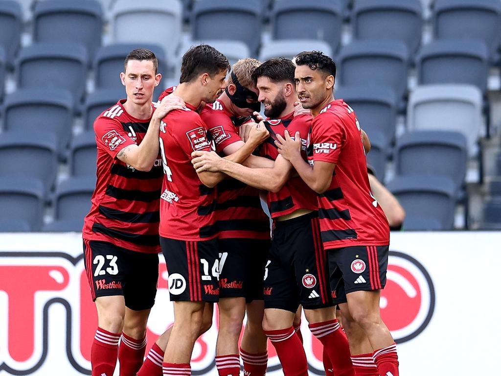 SYDNEY, AUSTRALIA - DECEMBER 22: Zachary Sapsford of the Wanderers celebrates scoring a goal with team mates during the round nine A-League Men match between Western Sydney Wanderers and Wellington Phoenix at CommBank Stadium, on December 22, 2024, in Sydney, Australia. (Photo by Brendon Thorne/Getty Images)