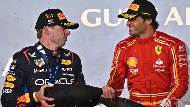 First placed Red Bull Racing's Dutch driver Max Verstappen and third placed Ferrari's Spanish driver Carlos Sainz. Photo by ANDREJ ISAKOVIC / AFP.