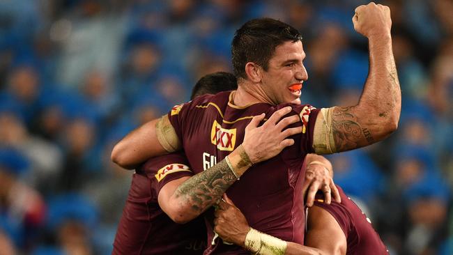 Matthew Gillett of the Maroons celebrates after Dane Gagai, (right), scored a try during State of Origin Game I between the NSW Blues and Queensland Maroons, at ANZ Stadium in Sydney on Wednesday, June 1, 2016. (AAP Image/Dan Himbrechts) NO ARCHIVING, EDITORIAL USE ONLY
