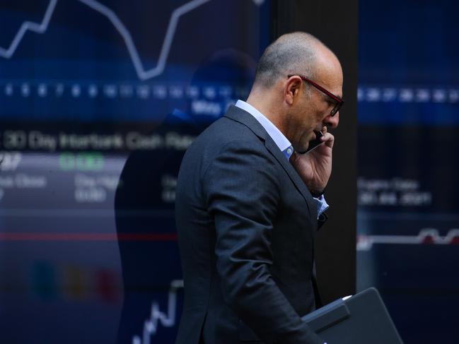 SYDNEY, AUSTRALIA - NewsWire Photos JUNE 01, 2021: A bussiness man is seen walking past the ASX in Sydney, Australia. Picture: NCA NewsWire / Gaye Gerard