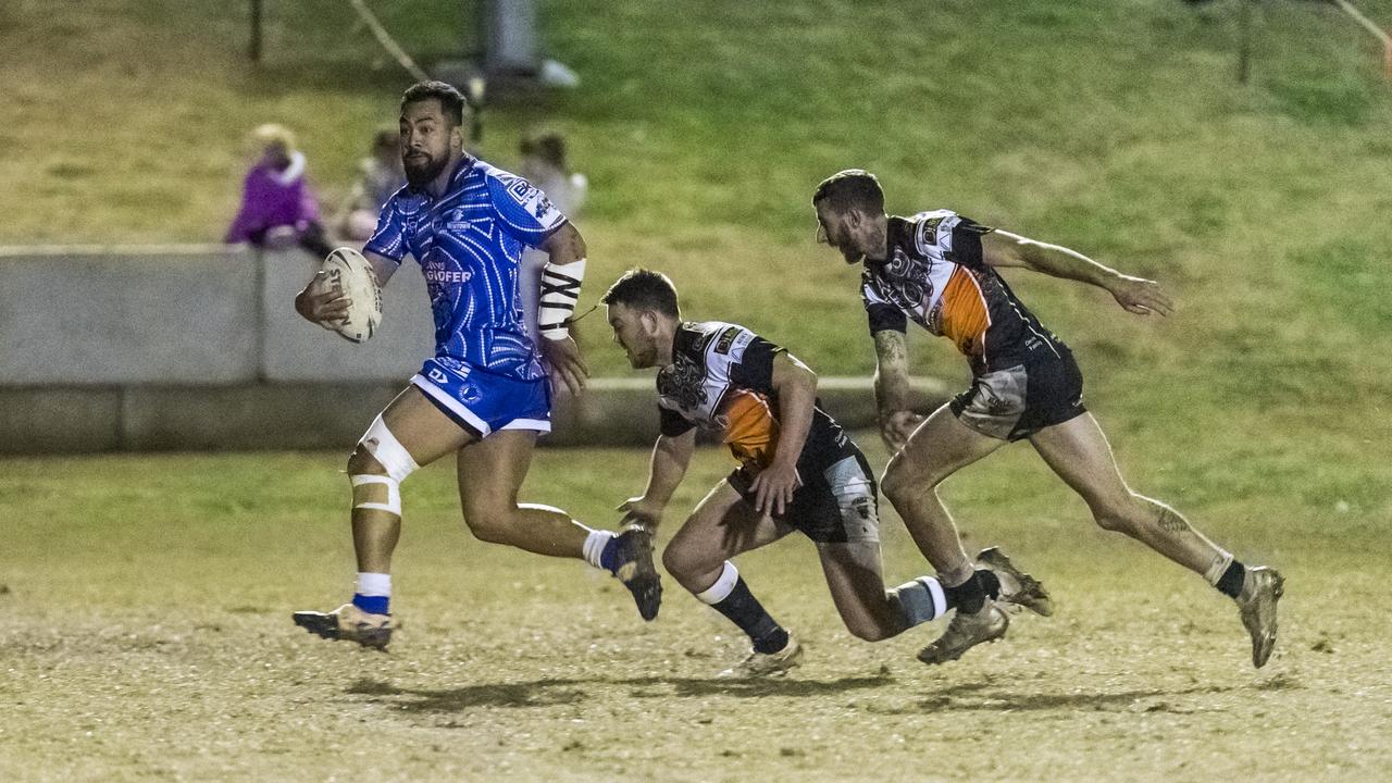 Newtown player Sione Lopamaua (left) gets away from Nick Ferris and Dylan Adamson of Oakey in TRL A grade round 12 rugby league at Jack Martin Centre, Saturday, July 10, 2021. Picture: Kevin Farmer