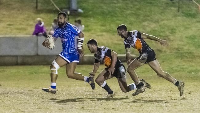 Newtown player Sione Lopamaua (left) gets away from Nick Ferris and Dylan Adamson of Oakey in TRL A grade round 12 rugby league at Jack Martin Centre, Saturday, July 10, 2021. Picture: Kevin Farmer