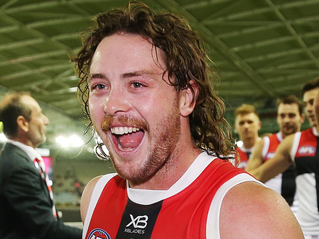 MELBOURNE, AUSTRALIA - MARCH 30: Jack Steven of the Saints celebrates the win Saints legend Nicky Winmar during the round two AFL match between the Essendon Bombers and the St Kilda Saints at Marvel Stadium on March 30, 2019 in Melbourne, Australia. (Photo by Michael Dodge/Getty Images)