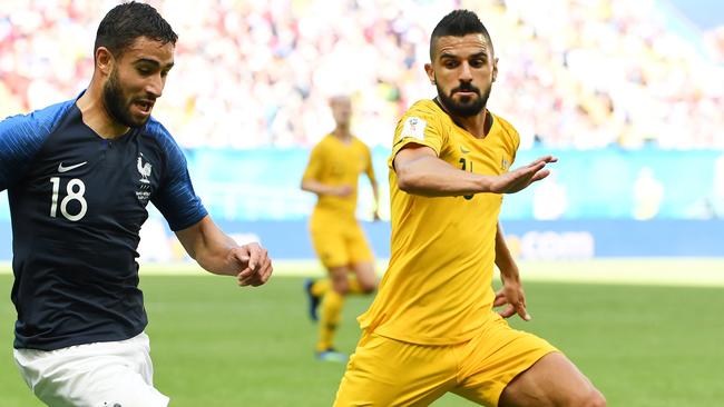 Aziz Behich tries to shut down Nabil Fekir.