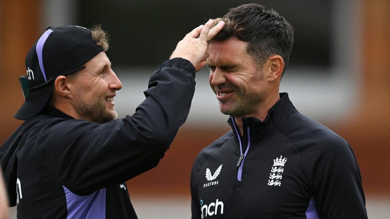 James Anderson of England with teammate Joe Root. Photo by Gareth Copley/Getty Images