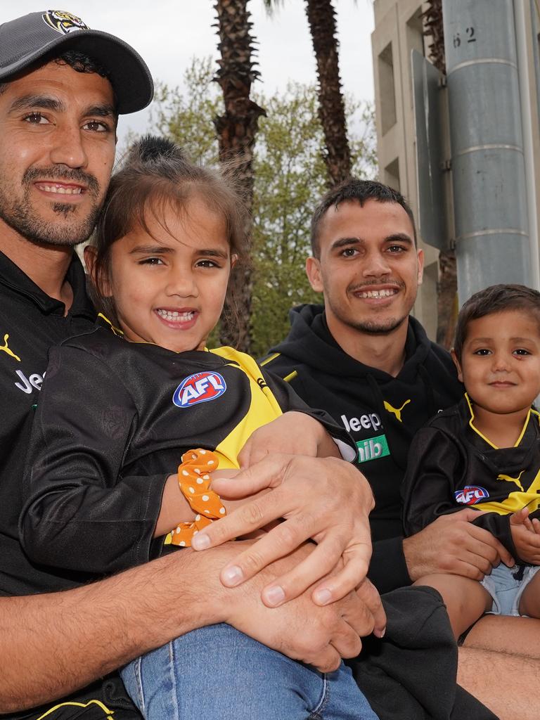 Marlion Pickett with his daughter Shaniquae, son Levi and Sydney Stack during the Grand Final parade.