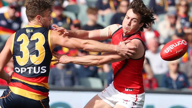 Essendon’s Andrew McGrath competes with Adelaide’s Brodie Smith. Picture: Sarah Reed