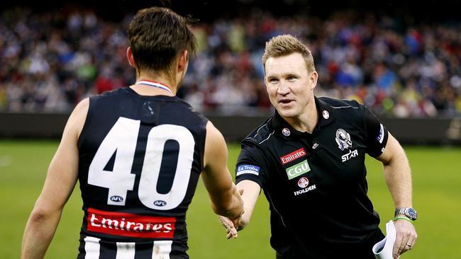 Paul Seedsman is congratulated by Nathan Buckley on Anzac Day. Picture: Wayne Ludbey