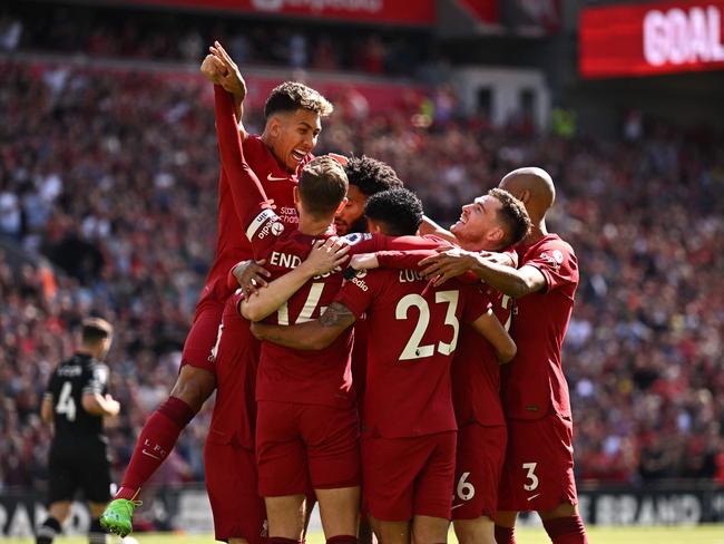 Liverpool's Colombian midfielder Luis Diaz (C) celebrates with teammates after scoring their first goal during the English Premier League football match between Liverpool and Bournemouth at Anfield in Liverpool, north west England on August 27, 2022. (Photo by Oli SCARFF / AFP) / RESTRICTED TO EDITORIAL USE. No use with unauthorized audio, video, data, fixture lists, club/league logos or 'live' services. Online in-match use limited to 120 images. An additional 40 images may be used in extra time. No video emulation. Social media in-match use limited to 120 images. An additional 40 images may be used in extra time. No use in betting publications, games or single club/league/player publications. /