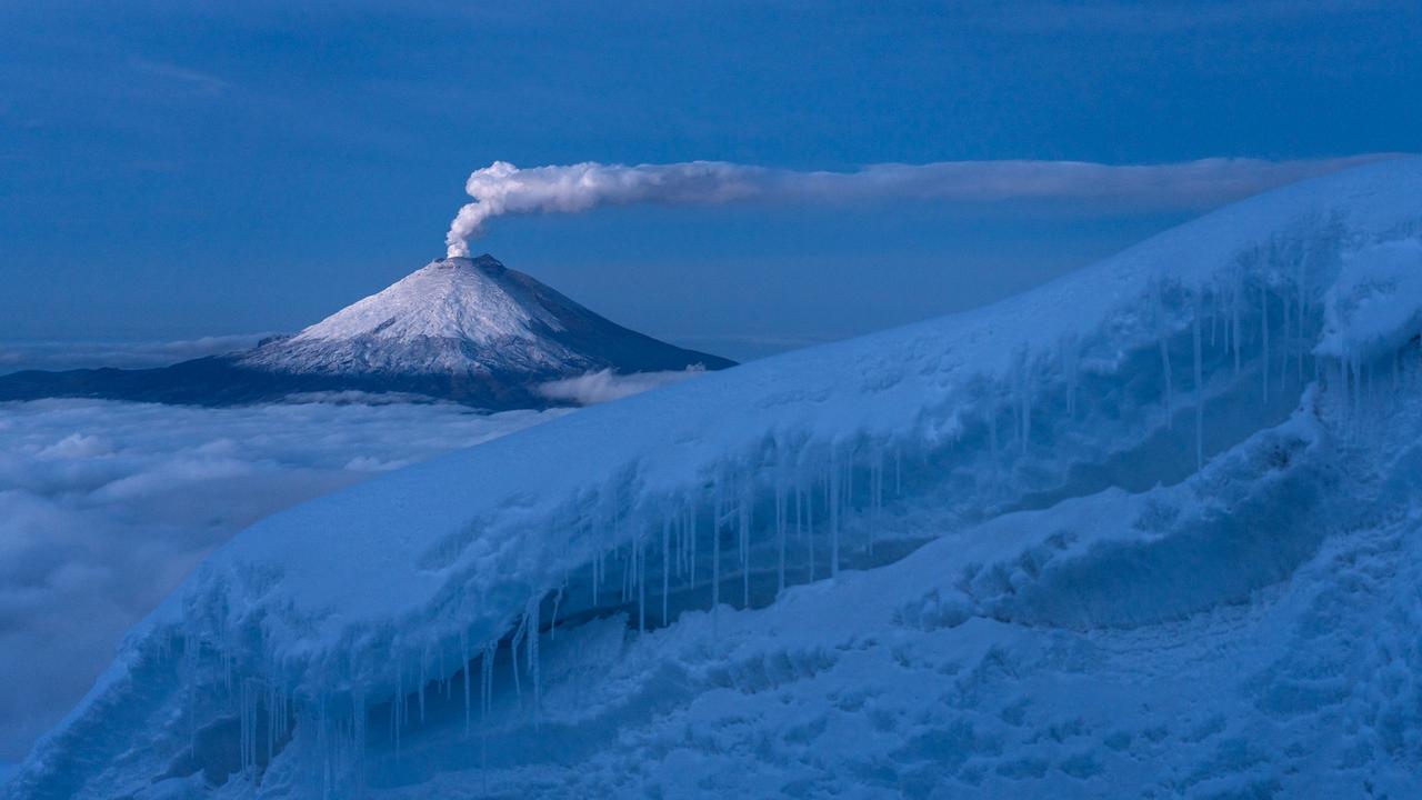 A view of the Cotopaxi volcano in Ecuador through the intricate Antisana glaciers, illuminated by the gentle rays of the rising sun. Picture: Roberto Valdez/TNC Photo Contest 2023