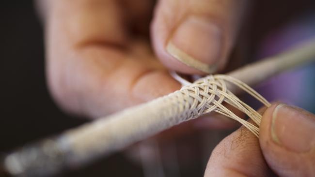 Handiwork: Sharron Taylor restoring a whip in the workshop. Picture: Zoe Phillips