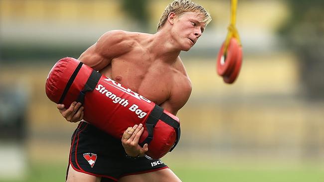 Isaac Heeney performs strength drills during a Sydney Swans AFL pre-season training session.