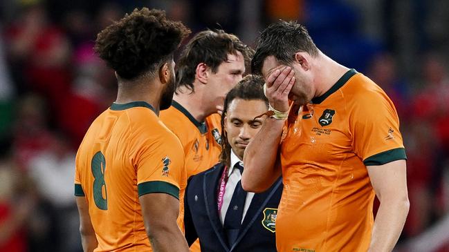 LYON, FRANCE - SEPTEMBER 24: Rob Valetini, Nick Frost and Tate McDermott of Australia look dejected at full-time following the Rugby World Cup France 2023 match between Wales and Australia at Parc Olympique on September 24, 2023 in Lyon, France. (Photo by Hannah Peters/Getty Images)