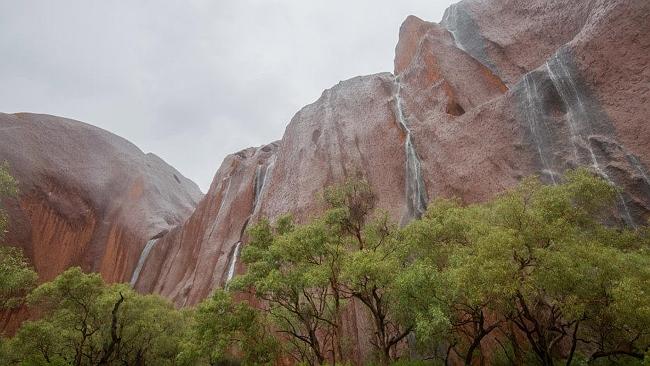 Uluru with its series of waterfalls. Picture: Tourism NT/Allan Dixon