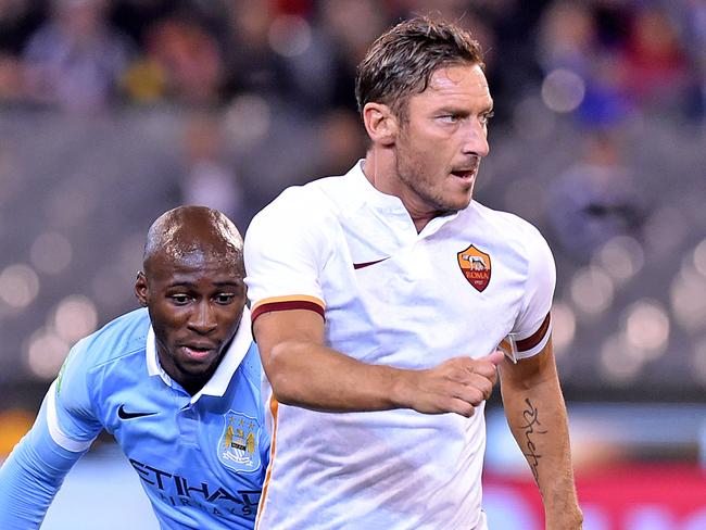 Francesco Totti of AS Roma controls the ball from Eliaquim Mangala of Manchester City, during the second match of the International Champions Cup, between AS Roma and Manchester City, played at the MCG in Melbourne, Tuesday, July 21, 2015. (AAP Image/Joe Castro) NO ARCHIVING