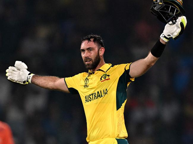 TOPSHOT - Australia's Glenn Maxwell celebrates after scoring a century (100 runs) during the 2023 ICC Men's Cricket World Cup one-day international (ODI) match between Australia and Netherlands at the Arun Jaitley Stadium in New Delhi on October 25, 2023. (Photo by Arun SANKAR / AFP) / -- IMAGE RESTRICTED TO EDITORIAL USE - STRICTLY NO COMMERCIAL USE --