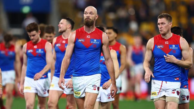 BRISBANE, AUSTRALIA - JUNE 28: Max Gawn and the Demons leave the field after the round 16 AFL match between Brisbane Lions and Melbourne Demons at The Gabba, on June 28, 2024, in Brisbane, Australia. (Photo by Chris Hyde/AFL Photos/via Getty Images)