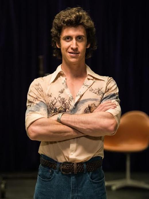 TJ Power as producer Robbie Weekes.
