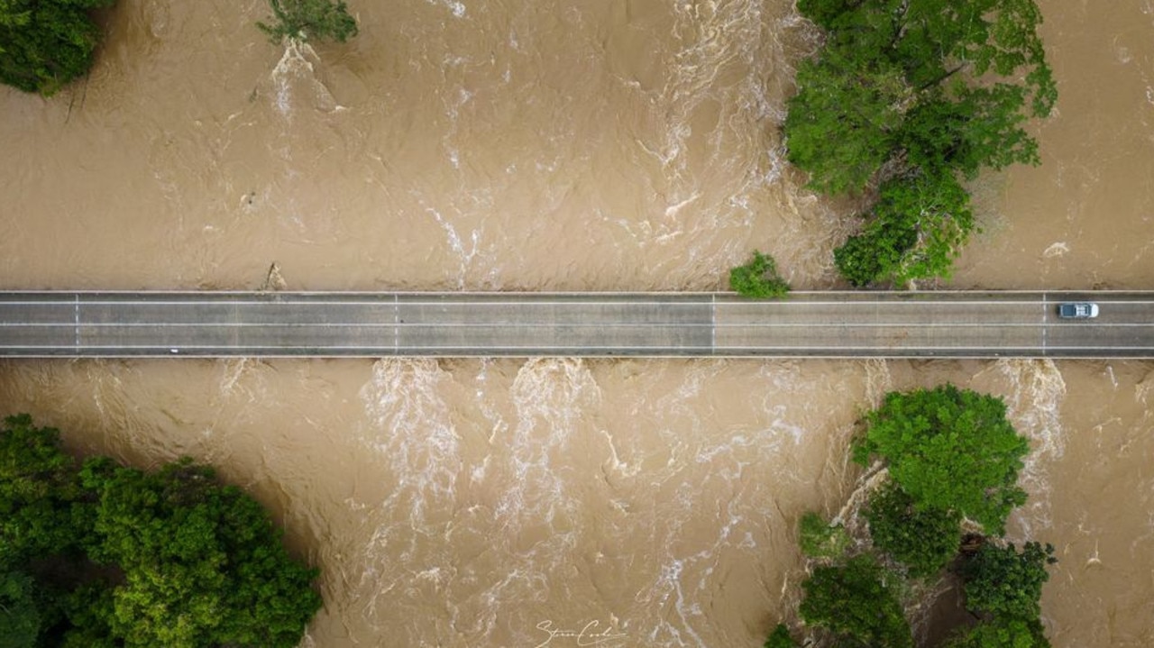 The Barron River threatens to cut off roads as floodwaters surge. Picture: Steve Cooke