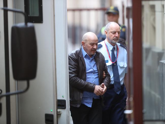 Frank Madafferi is taken from a prison van into the Supreme Court. Picture: David Crosling