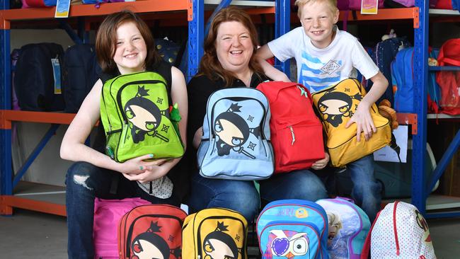 CARING: Rachael Zaltron and her children Holly, 12, and Noah, 9, at Backpacks 4 SA Kids in Para Hills West. Picture: AAP Image/ KERYN STEVENS<b/>