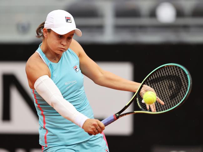 ROME, ITALY - MAY 14: Ashleigh Barty of Australia hits a backhand to  Coco Gauff of the USA during their match on Day Seven of the Internazionali BNL D'Italia at Foro Italico on May 14, 2021 in Rome, Italy. Sporting stadiums around Italy remain under strict restrictions due to the Coronavirus Pandemic as Government social distancing laws prohibit fans inside venues resulting in games being played behind closed doors. (Photo by Clive Brunskill/Getty Images)