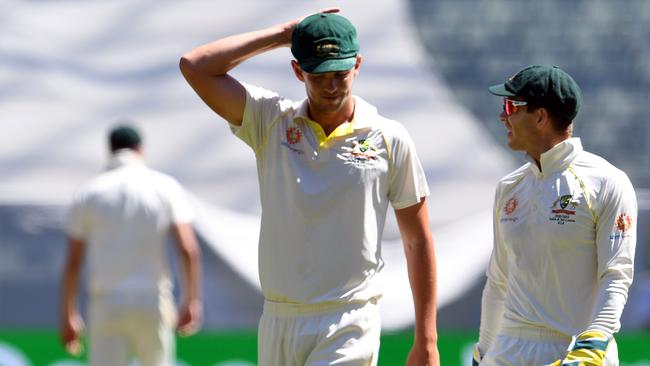 Australia's captain Tim Paine (right) talks with Josh Hazlewood during the Boxing Day Test. Pic: AFP