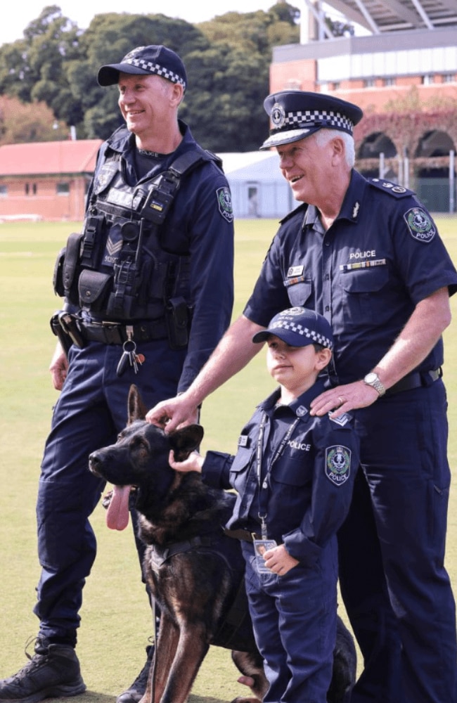 The 8yo got to meet the police dogs, and was also tasked to hunt down three "hardened crims." Picture: Russell Millard